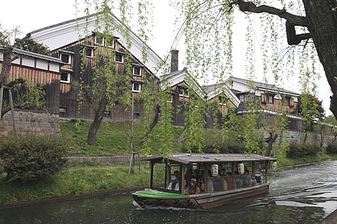 The view of the Gekkeikan Uchigura Sake Brewery on the far bank of the Horikawa River